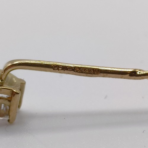 661 - A 20th century yellow coloured metal and diamond solitaire stick pin Provenance:  From a single owne... 