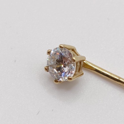 661 - A 20th century yellow coloured metal and diamond solitaire stick pin Provenance:  From a single owne... 