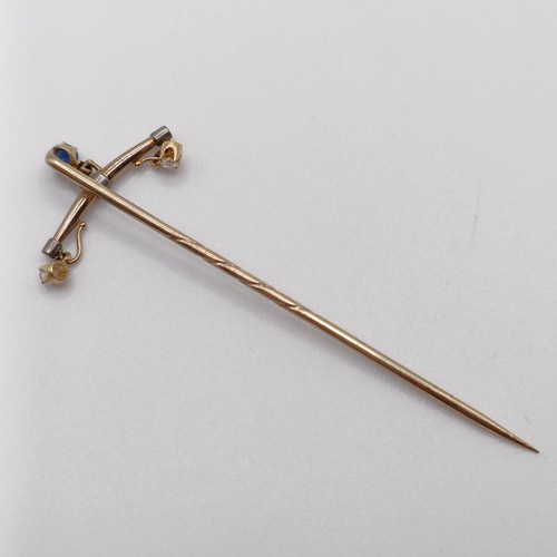 659 - A 20th century yellow coloured metal, sapphire and diamond stick pin  Provenance:  From a single own... 