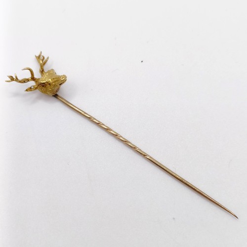 658 - A late 19th/early 20th century yellow coloured metal stick pin, in the form of a stag Provenance:  F... 