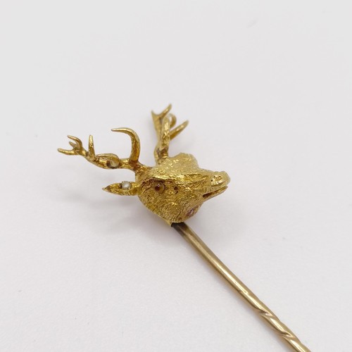 658 - A late 19th/early 20th century yellow coloured metal stick pin, in the form of a stag Provenance:  F... 