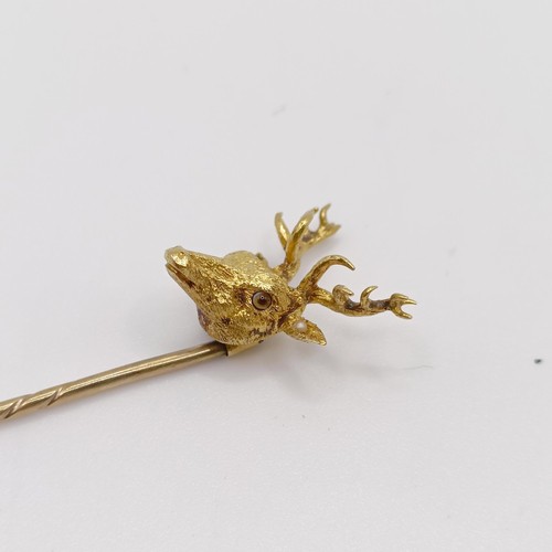 658 - A late 19th/early 20th century yellow coloured metal stick pin, in the form of a stag Provenance:  F... 