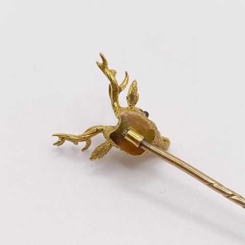 658 - A late 19th/early 20th century yellow coloured metal stick pin, in the form of a stag Provenance:  F... 