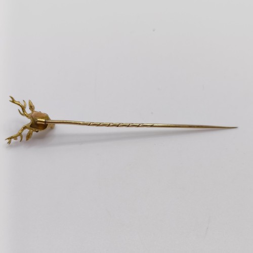 658 - A late 19th/early 20th century yellow coloured metal stick pin, in the form of a stag Provenance:  F... 