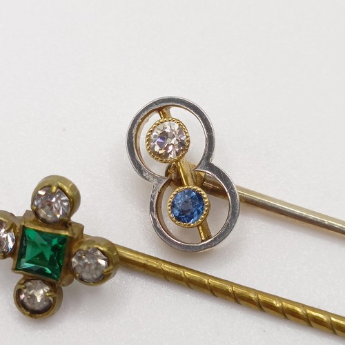 652 - An Art Deco yellow coloured metal, diamond and sapphire stick pin, and a brass and paste stick pin (... 