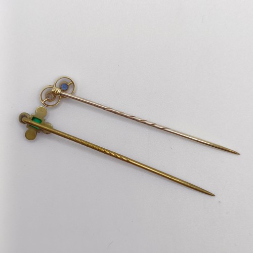 652 - An Art Deco yellow coloured metal, diamond and sapphire stick pin, and a brass and paste stick pin (... 