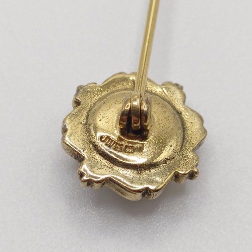 649 - A late 19th/early 20th century yellow coloured metal stick pin, inset with micro-mosaic, decorated f... 