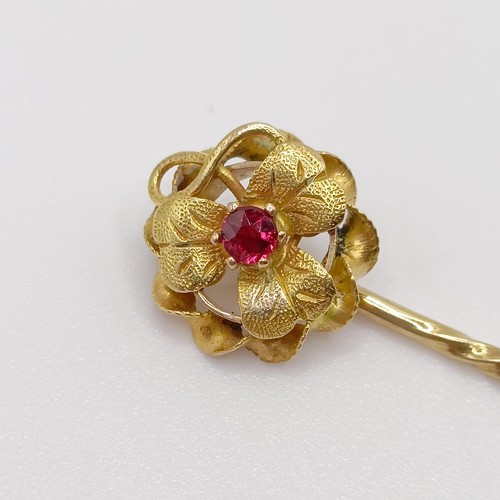 647 - A 20th century yellow coloured metal and ruby stick pin  Provenance:  From a single owner collection... 