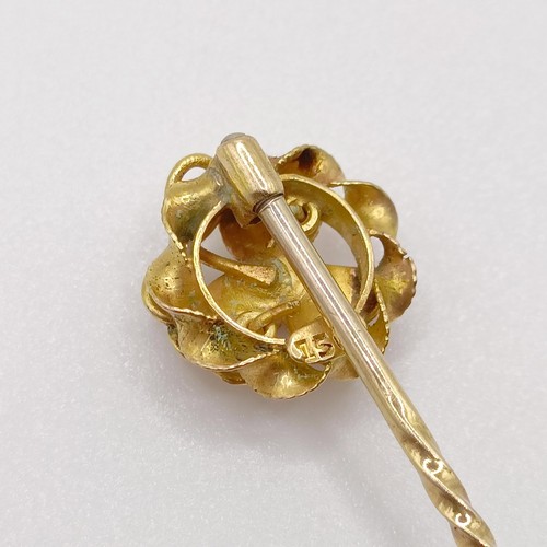 647 - A 20th century yellow coloured metal and ruby stick pin  Provenance:  From a single owner collection... 