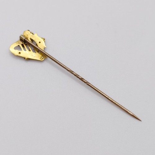 645 - A late 19th/early 20th century yellow coloured metal stick pin, in the form of a harp  Provenance:  ... 