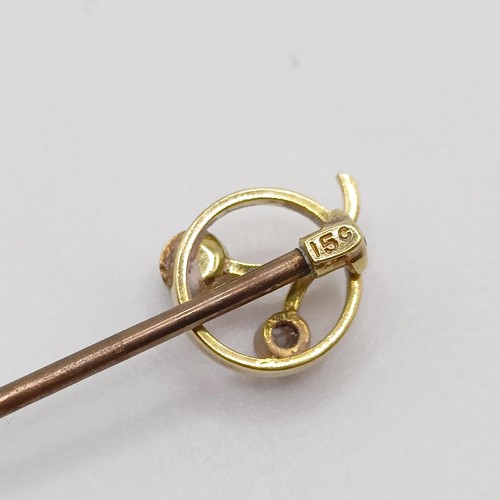 642 - An early 20th century yellow coloured metal, diamond and pearl stick pin   Provenance:  From a singl... 