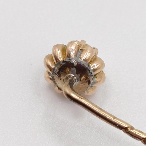 641 - A late 19th/early 20th century yellow metal and pearl stick pin  Provenance:  From a single owner co... 