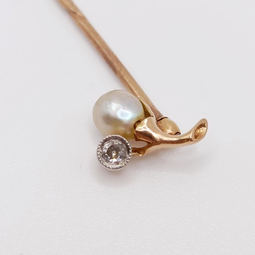 640 - An early 20th century yellow metal, diamond and pearl stick pin  Provenance:  From a single owner co... 