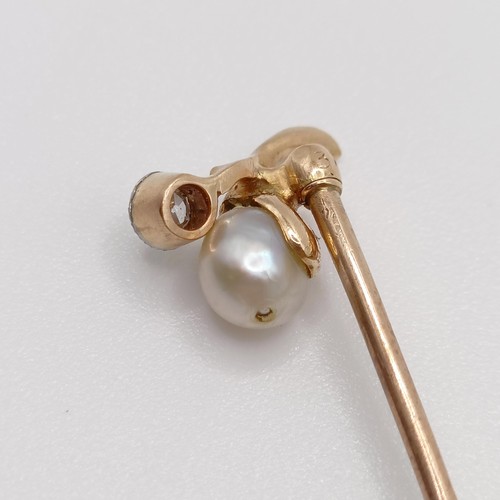 640 - An early 20th century yellow metal, diamond and pearl stick pin  Provenance:  From a single owner co... 