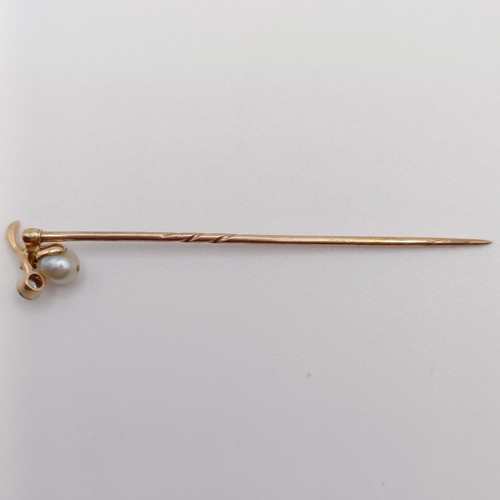 640 - An early 20th century yellow metal, diamond and pearl stick pin  Provenance:  From a single owner co... 