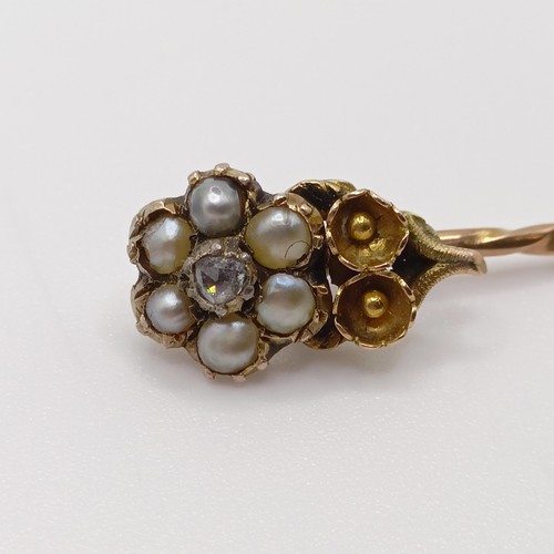 638 - A late 19th/early 20th century yellow coloured metal, pearl and diamond stick pin, in the form of a ... 