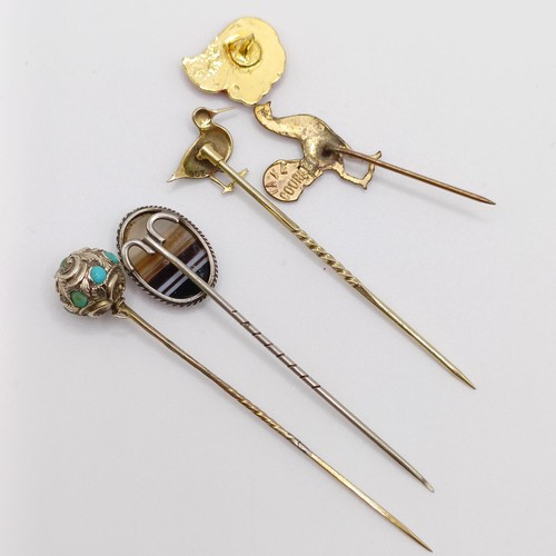 633 - A gilt metal stick pin, in the form of a cockerel, three other stick pins and a badge (5) Provenance... 