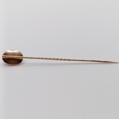 632 - A late 19th/early 20th century yellow metal, tiger's eye and seed pearl stick pin  Provenance:  From... 