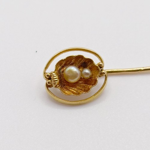 629 - A late 19th/early 20th century yellow coloured metal and pearl stick pin, in the form of an oyster  ... 