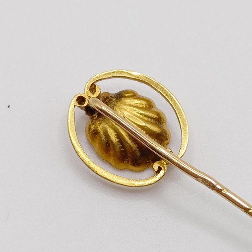 629 - A late 19th/early 20th century yellow coloured metal and pearl stick pin, in the form of an oyster  ... 