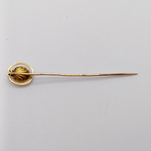 629 - A late 19th/early 20th century yellow coloured metal and pearl stick pin, in the form of an oyster  ... 