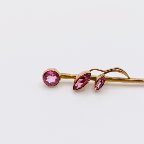 628 - A yellow coloured metal and pink stone stick pin  Provenance:  From a single owner collection of Vic... 