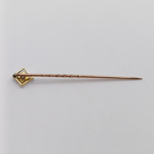 627 - A yellow coloured metal and diamond stick pin  Provenance:  From a single owner collection of Victor... 