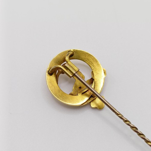 625 - A late 19th/early 20th century yellow metal stick pin, in the form of a belt  Provenance:  From a si... 