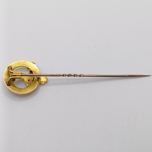 625 - A late 19th/early 20th century yellow metal stick pin, in the form of a belt  Provenance:  From a si... 