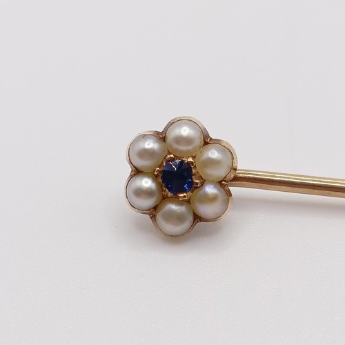 624 - A late 19th/early 20th century yellow metal, sapphire and seed pearl stick pin  Provenance:  From a ... 