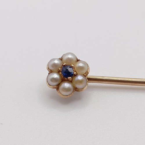 624 - A late 19th/early 20th century yellow metal, sapphire and seed pearl stick pin  Provenance:  From a ... 