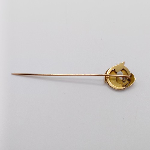 622 - A late 19th/early 20th century yellow coloured metal and diamond stick pin, in the form of a dragon ... 