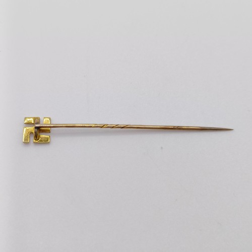 620 - A late 19th/early 20th century stick pin, decorated Mangi symbol Provenance:  From a single owner co... 