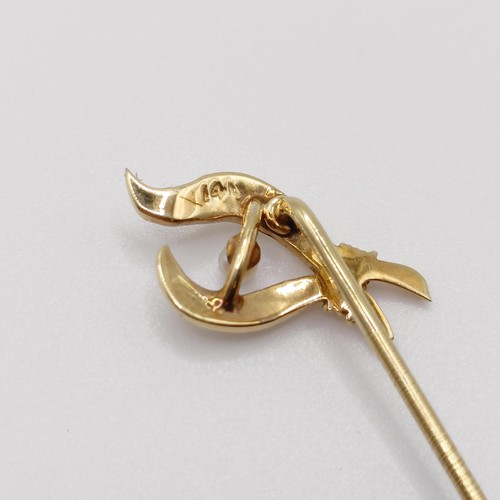 617 - A late 19th/early 20th century yellow metal and seed pearl stick pin  Provenance:  From a single own... 