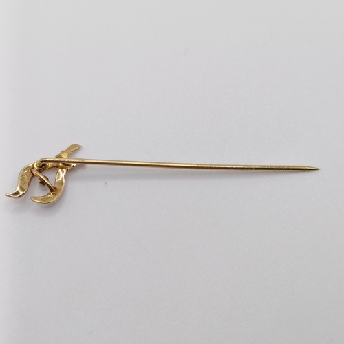 617 - A late 19th/early 20th century yellow metal and seed pearl stick pin  Provenance:  From a single own... 