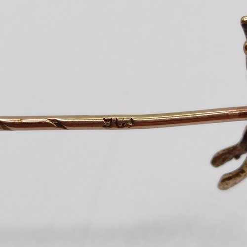 611 - A late 19th/early 20th century yellow metal stick pin, in the form of a fox Provenance:  From a sing... 