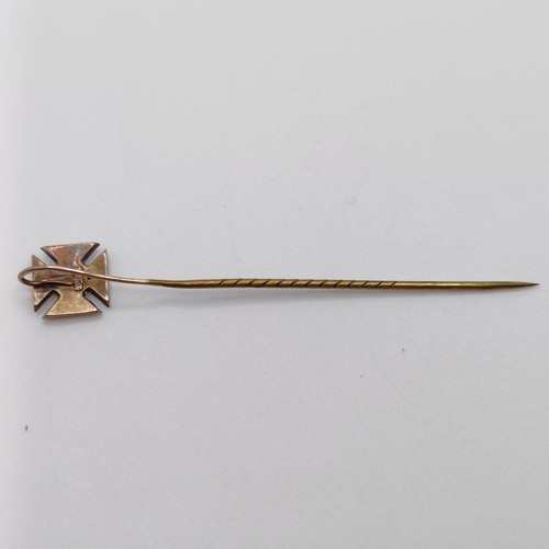 608 - A late 19th/early 20th century yellow metal stick pin, in the form of a cross  Provenance:  From a s... 