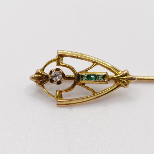 606 - An Art Nouveau yellow metal, diamond and green stone stick pin  Provenance:  From a single owner col... 