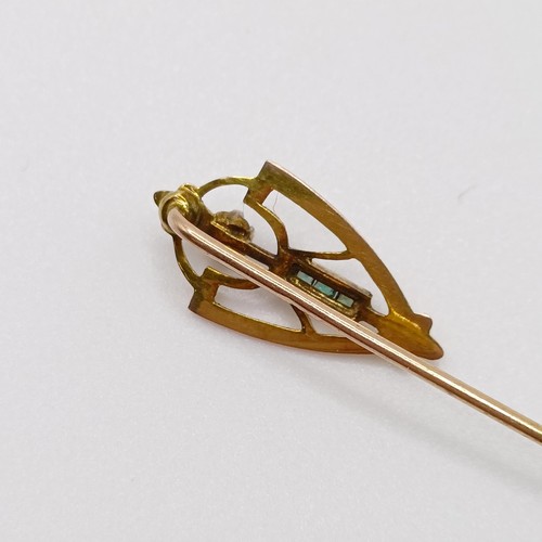 606 - An Art Nouveau yellow metal, diamond and green stone stick pin  Provenance:  From a single owner col... 