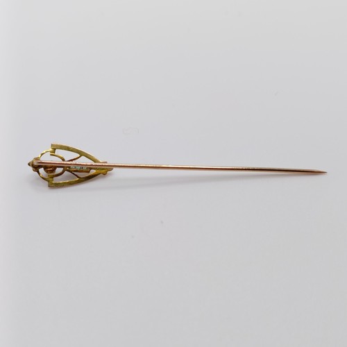 606 - An Art Nouveau yellow metal, diamond and green stone stick pin  Provenance:  From a single owner col... 