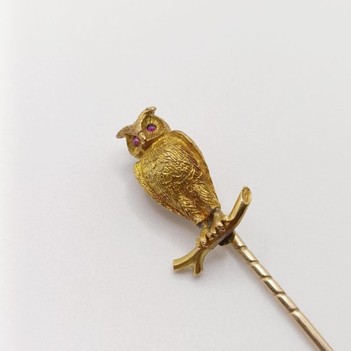 543 - A late 19th/early 20th century yellow metal stick pin, in the form of an owl perched on a twig Prove... 