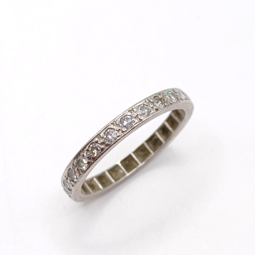 798 - A diamond full eternity ring, ring size O, and a 18ct gold, platinum and diamond five stone ring, ri... 