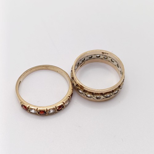 796 - A 9ct gold and white stone full eternity ring, ring size K, and a white stone and red stone half ete... 