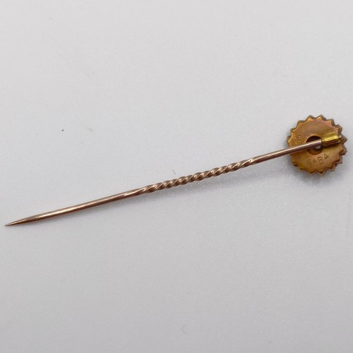 793 - A late 19th/early 20th century yellow metal and white stone stick pin, in a vintage jewellery box