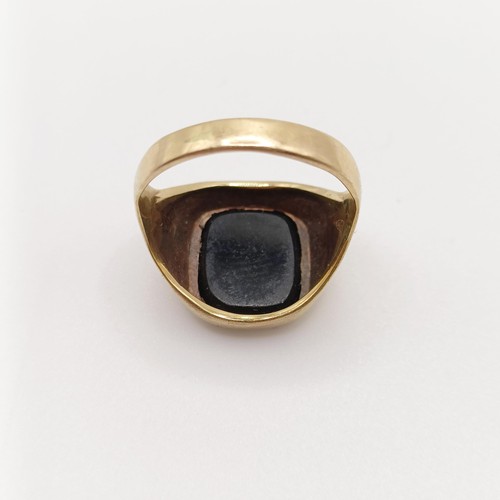 791 - A 9ct gold and black stone signet ring, ring size M