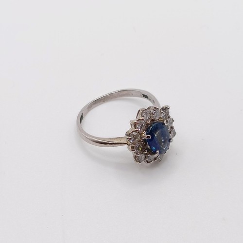 805 - An 18ct white gold, sapphire and diamond ring, ring size M