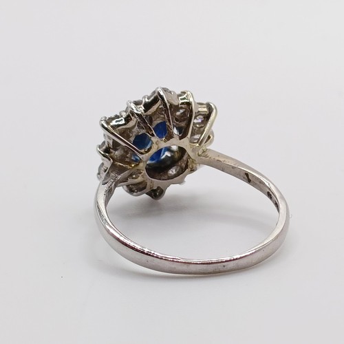 805 - An 18ct white gold, sapphire and diamond ring, ring size M