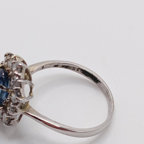 805 - An 18ct white gold, sapphire and diamond ring, ring size M