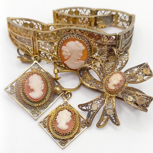 711 - An early 20th century gilt metal and cameo bracelet, a matching brooch, pendant, and a single earrin... 