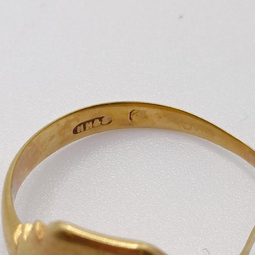 709 - A 9ct gold signet ring, bent, and a 9ct gold wedding band, ring size K, 7.4 g